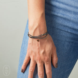 eNewton Design FACETED HEMATITE SIGNATURE CROSS GOLD CHARM BRACELET