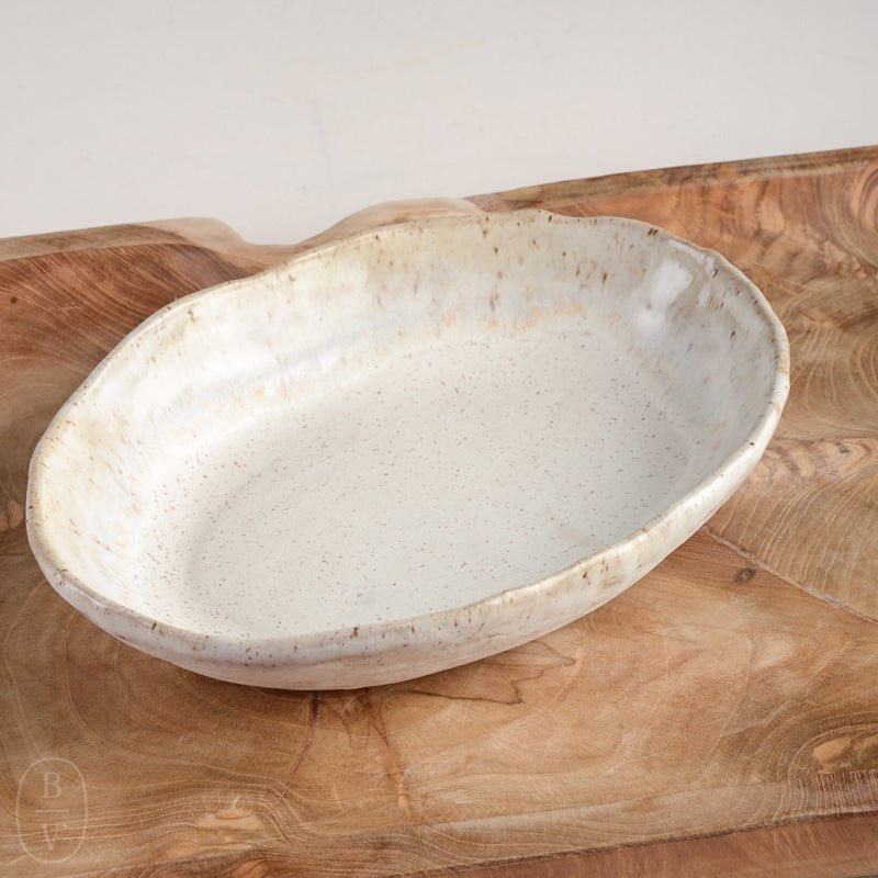 Making a Handmade ceramic covered oval baking dish on the pottery